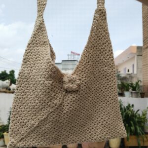 beige triangle crochet bag