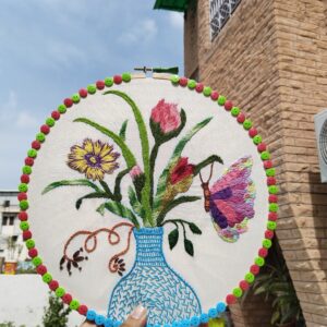 butterfly bloom in blue vase