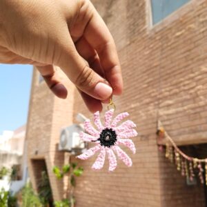 black center pink daisy