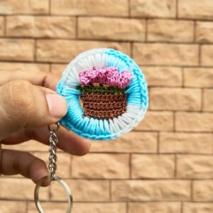 bloom basket crochet keychain – sky blue & pink flowers