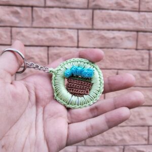 bloom basket crochet keychain – green border & blue flowers