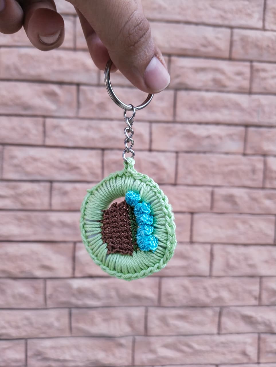 bloom basket crochet keychain – green border & blue flowers bloom basket crochet keychain – green border & blue flowers