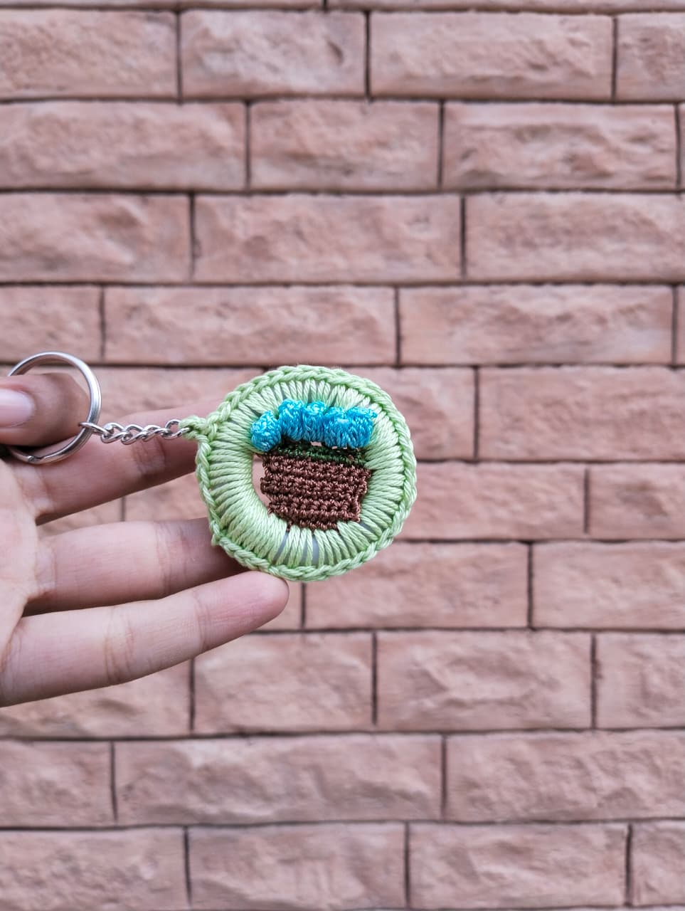 bloom basket crochet keychain – green border & blue flowers bloom basket crochet keychain – green border & blue flowers